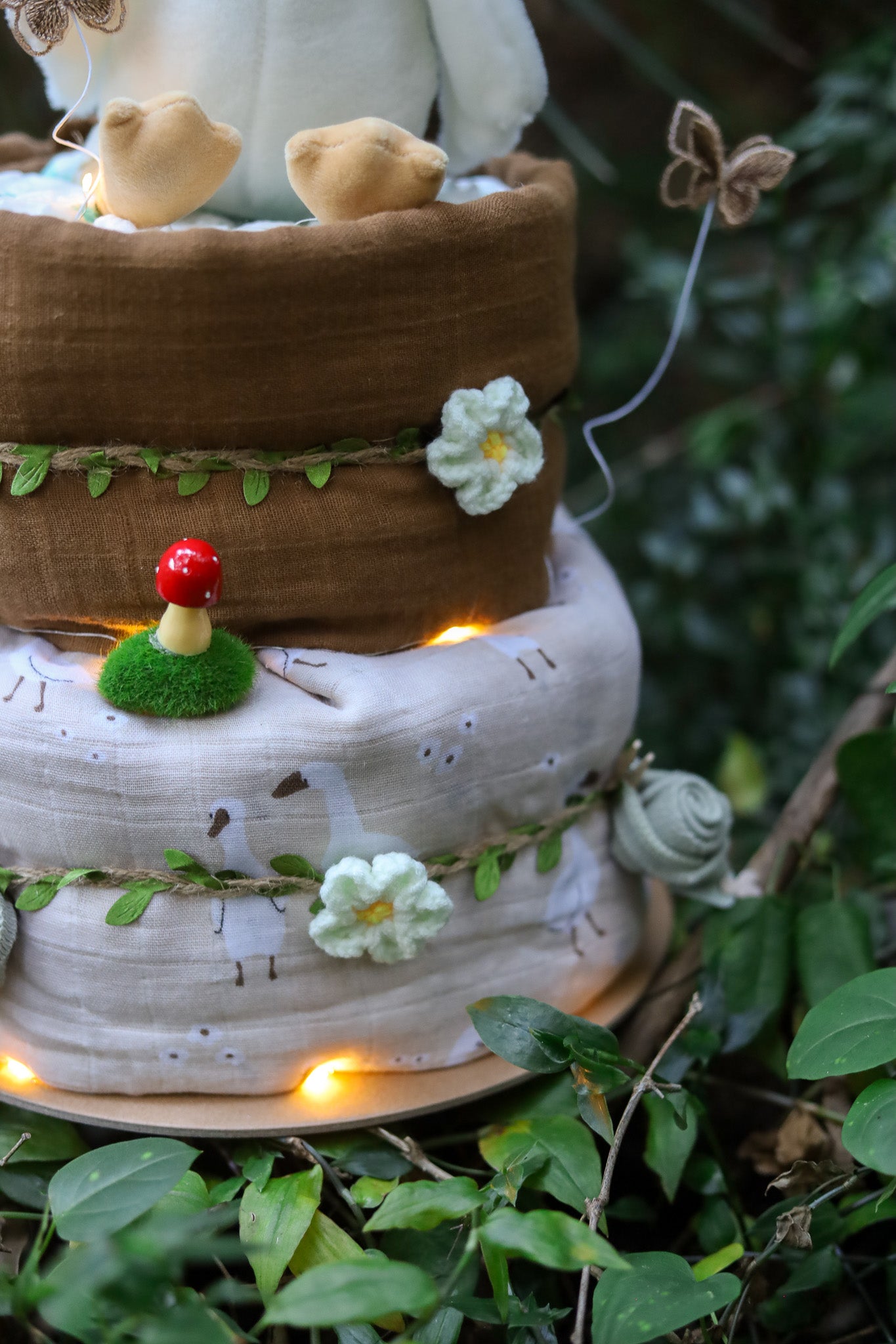 enchanting woodlands 2-tier nappy diaper cake decorated with fairy lights, butterflys and flowers