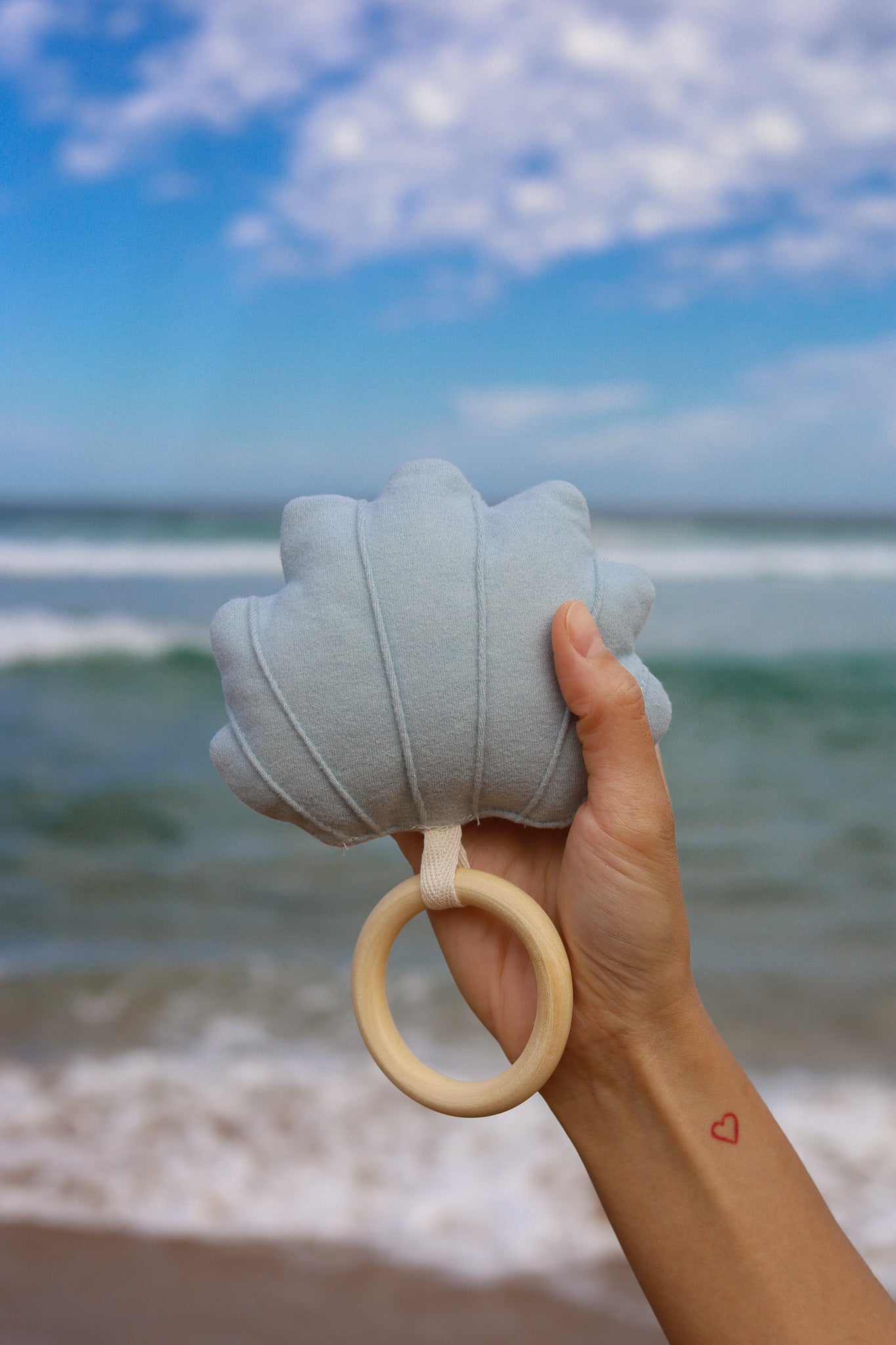 Large soft light blue shell rattle for newborn baby as part of 3-tier Charming Sea nappy cake