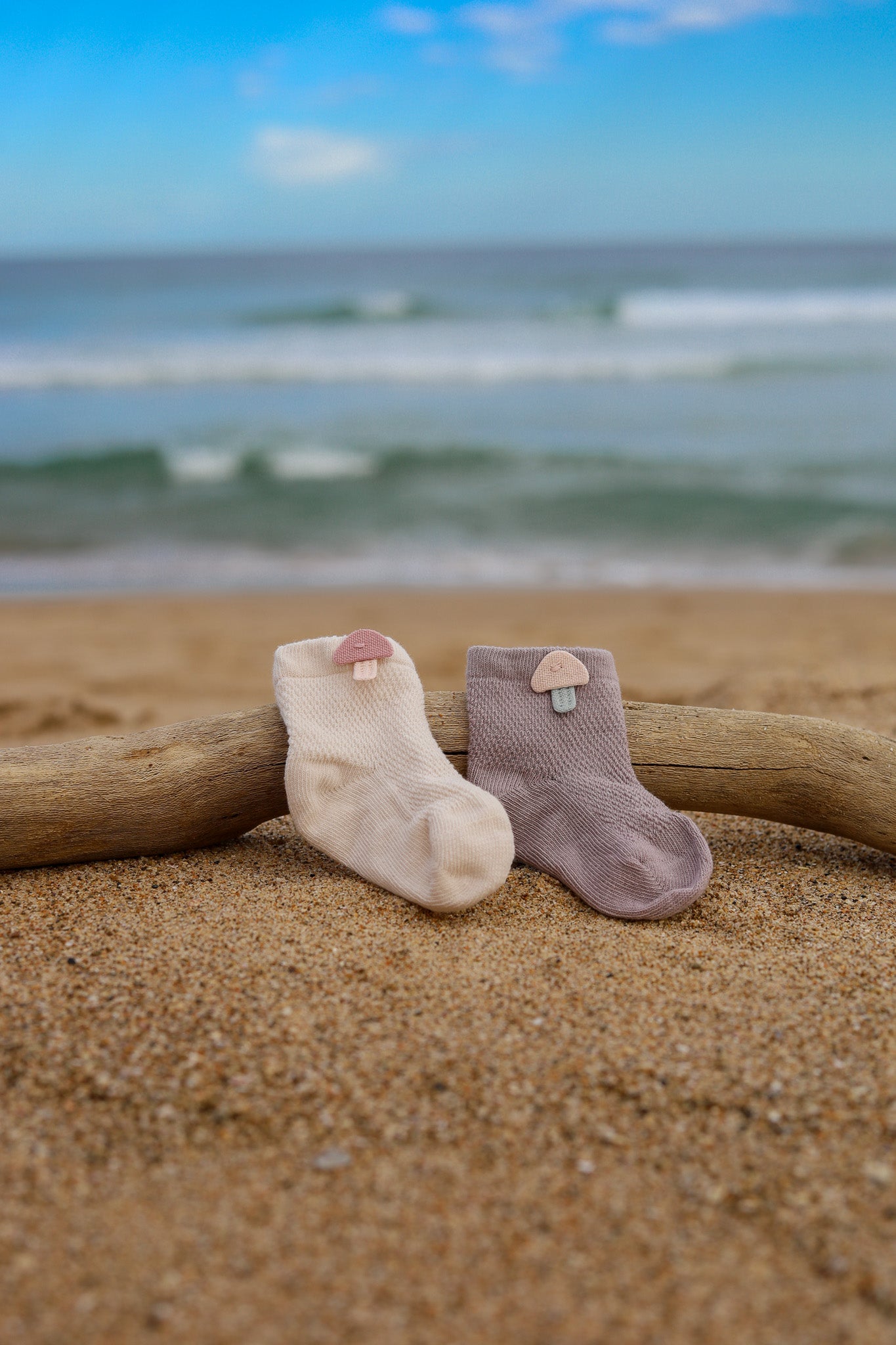 2 pairs of breathable cotton socks for newborn baby as part of 3-tier Charming Sea nappy cake. Colours will vary depending on availability.